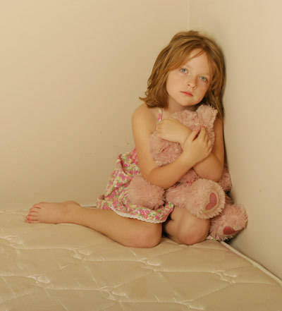 A sad girl symbolizes the destructive nature of family violence.